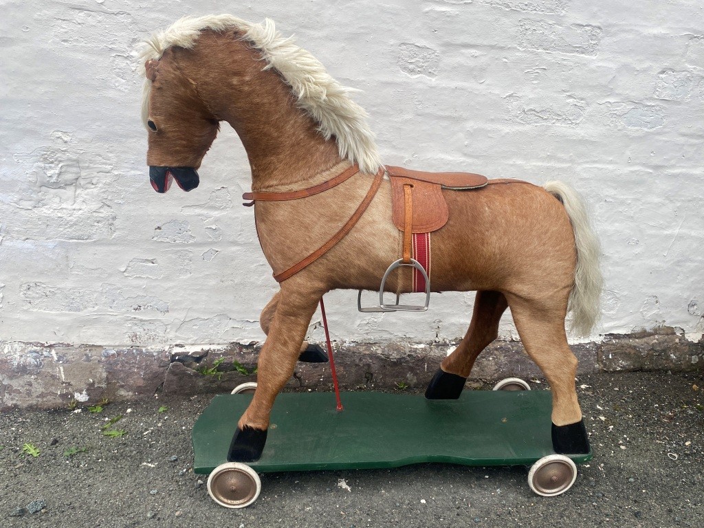 Hide covered antique rocking horse