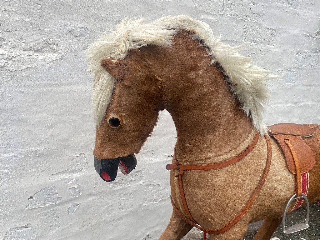 early hide covered rocking horse
