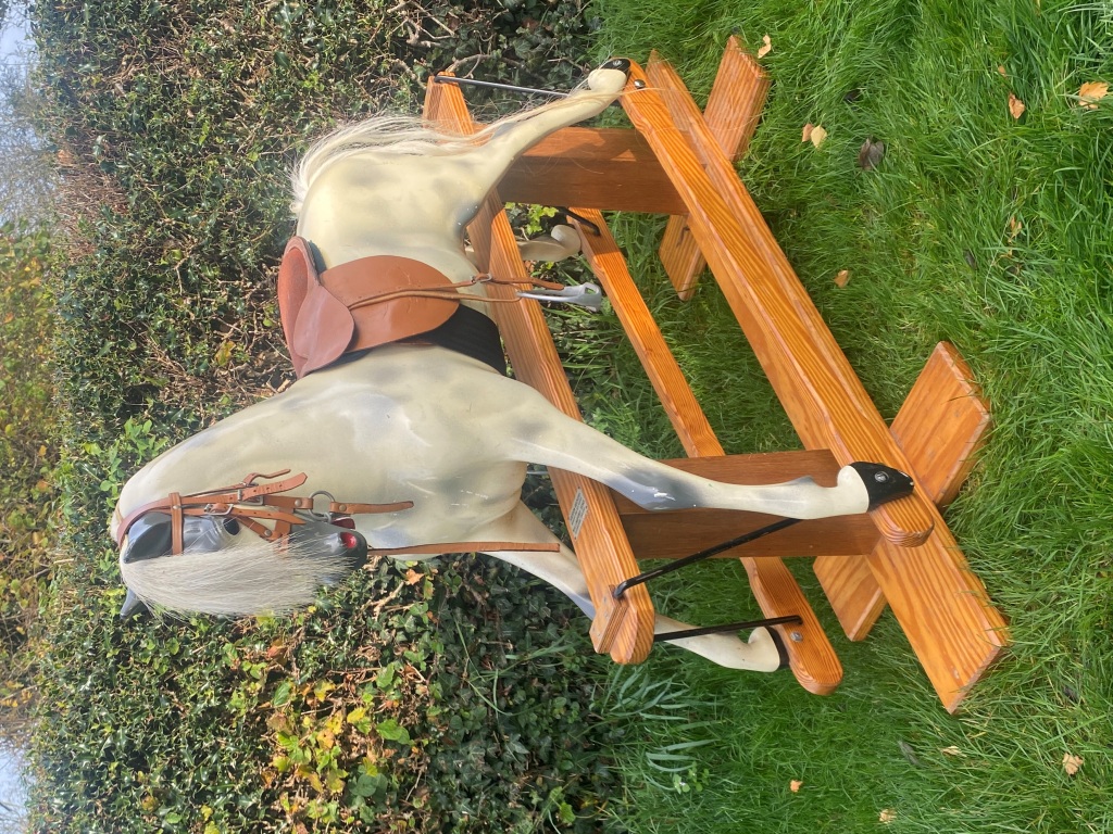 head lines wooden rocking horse